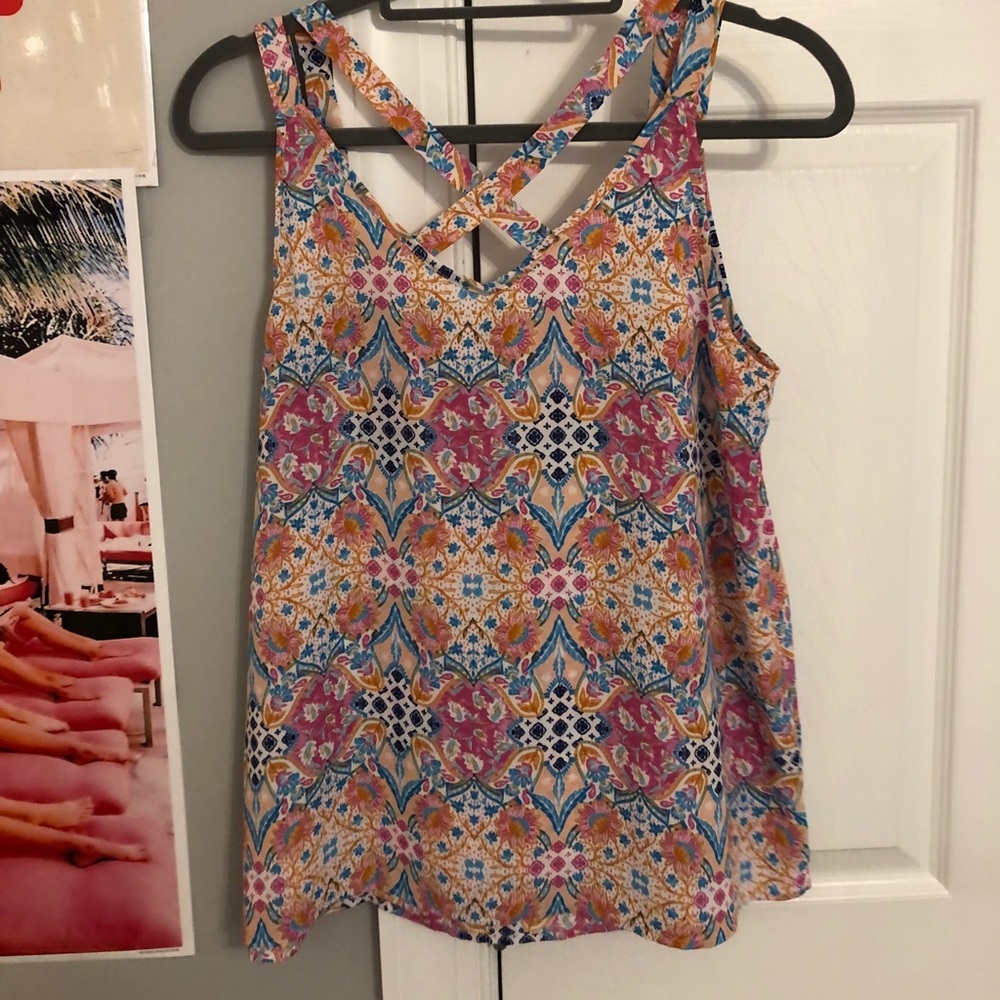 Two strap floral tank. Crosses in the back